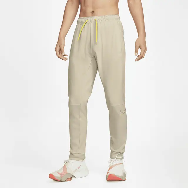 NIKE AS M NK DF DRY TPR PANT 6/1 PA in RATTAN/YELLOW ST